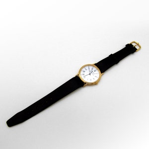 Relógio de pulso Tiffany Portfolio Quartz com moldura banhada a ouro Swiss Made
