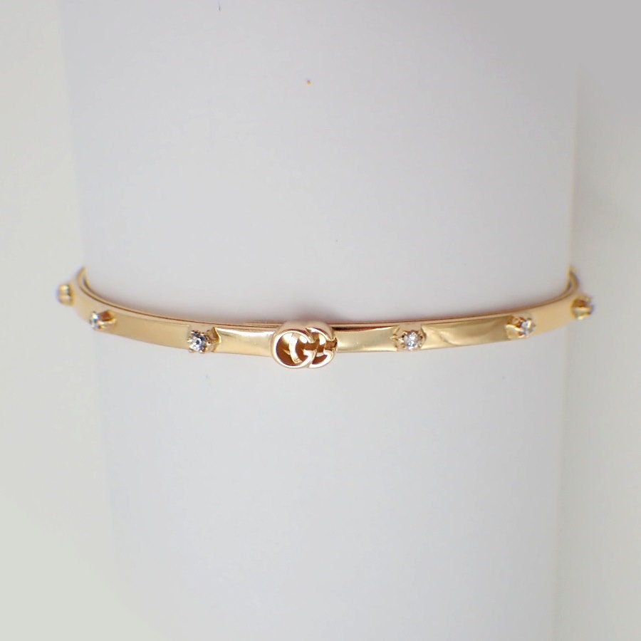 Gucci Running G-armband met diamanten accenten, 18K goud, maat 17 - Etsy  België