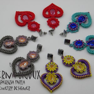 May include: Six pairs of beaded heart earrings with crystal accents. The earrings are in various colors, including red, pink, gray, turquoise, blue, yellow, and purple.