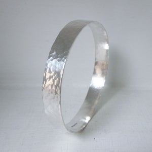 Wide hammered silver bangle