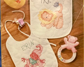2002 Vintage New Plaid Bucilla Lot of 2 Prefinished Bibs Jungle Babies Poly Cotton Cloth Stamped cross stitch 43223