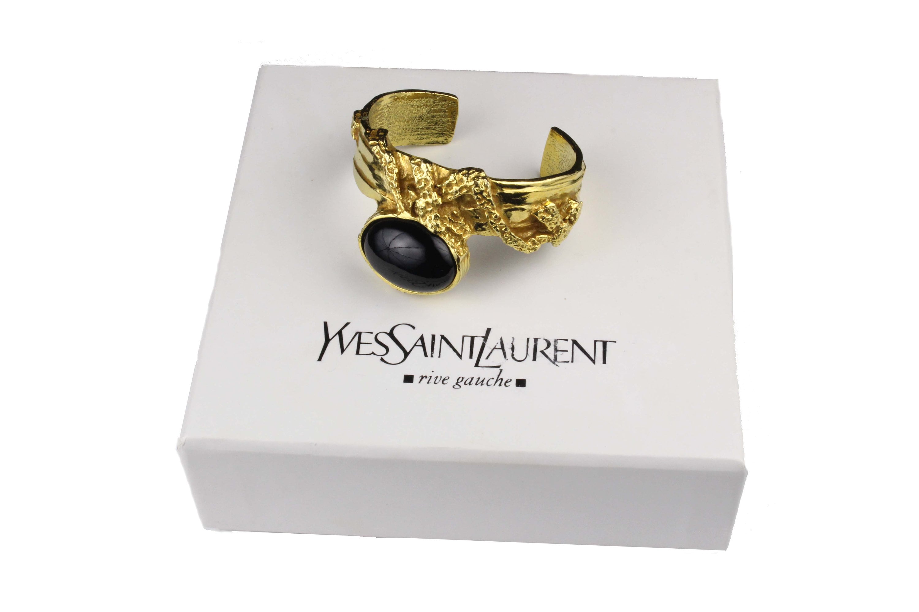 YVES SAINT LAURENT, ring, gold patinated metal, original dust bag and box  included. Vintage clothing & Accessories - Auctionet