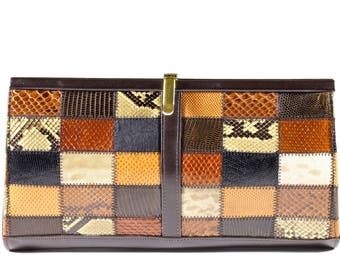 May include: A brown leather clutch bag with a patchwork design of different coloured snakeskin patterns. The bag has a gold clasp.