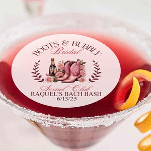 May include: Pink and brown round sticker with the text "Boots & Bubbly Bridal Social Club Raquel's Bach Bash 6/13/25" and a graphic of pink cowboy boots and flowers. The sticker is on top of a margarita glass with a pink drink and a lemon twist.