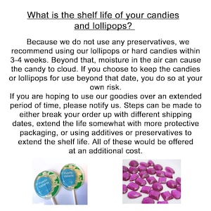 May include: Two lollipops with a green and white design and the text "Puerto Vallarta" on them. The lollipops are on white sticks. A pile of purple, diamond-shaped candies are in the background.