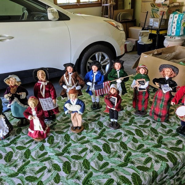 Holiday 1776 style marching band and singers.. twelve large   dolls.. nine are 13"tall  three young folks are 9" tall. whole set 65.00