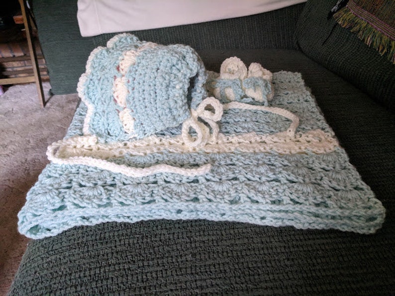Baby afghan blue and cream trim crocheted by me 35x37shell stitch