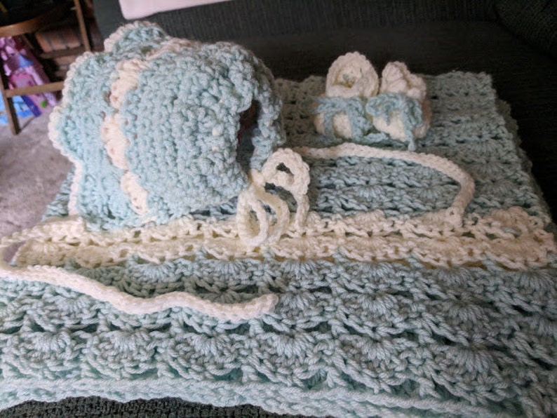 Baby afghan blue and cream trim crocheted by me 35x37shell stitch