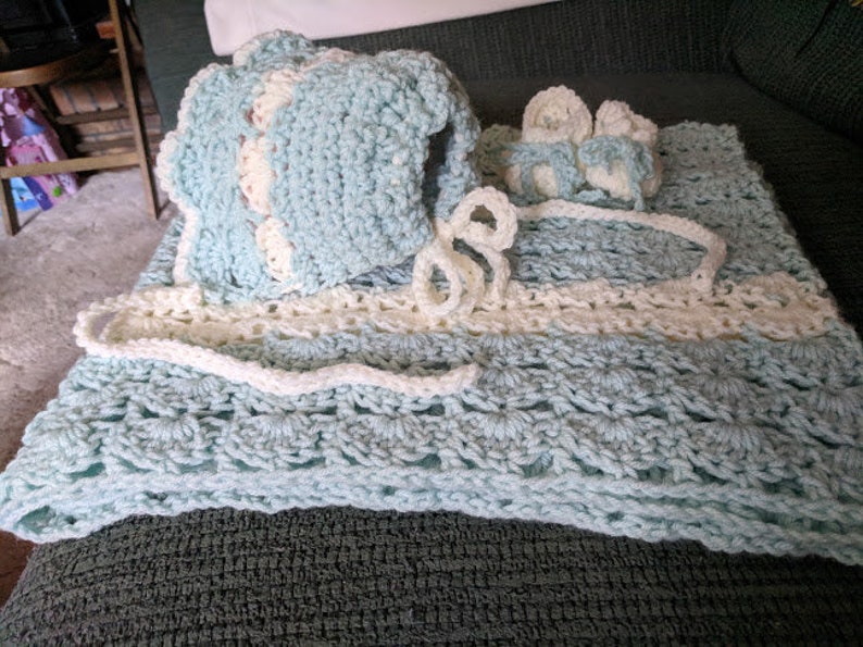 Baby afghan blue and cream trim  crocheted by me 35x37shell stitch