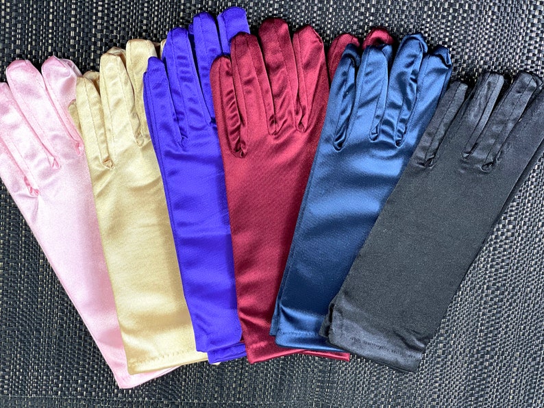 May include: Six pairs of long satin gloves in different colors: pink, beige, blue, burgundy, navy blue, and black.