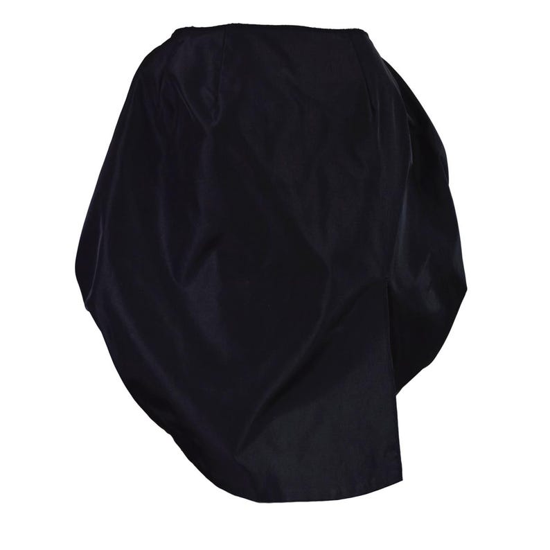 May include: A black, asymmetrical skirt made of a smooth, silky fabric. The skirt has a flowing, draped design and a slightly gathered look.