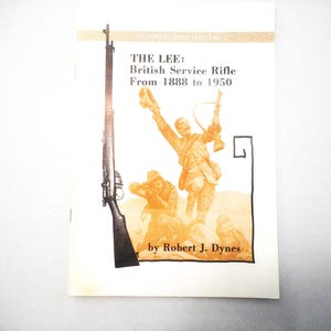 May include: A book cover with the title "THE LEE: British Service Rifle From 1888 to 1950" and an illustration of soldiers and a rifle. The cover is primarily white with orange and black accents.