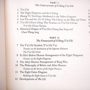 May include: Open book page with text about I Ching Tai Chi. The page is divided into two parts, with numbered sections and titles such as "The Eight Diagrams and the I Ching" and "The T'ai Chi Symbol".