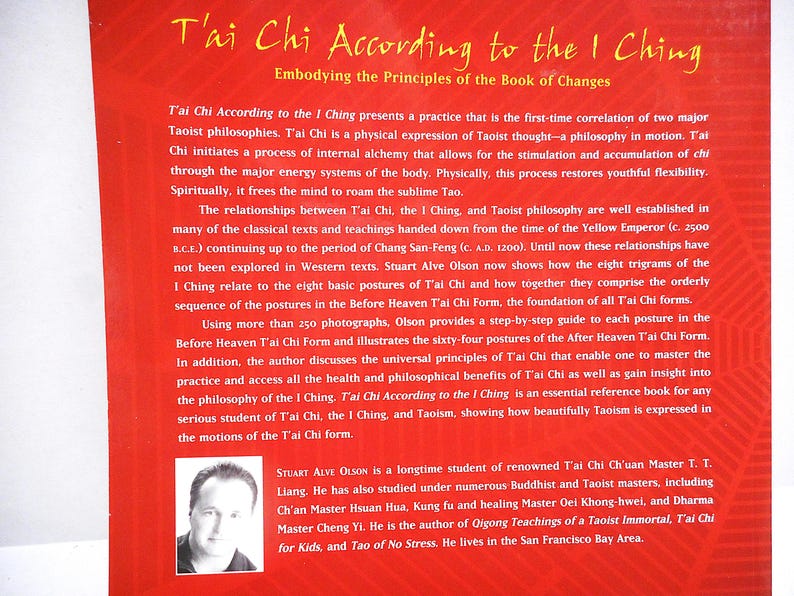 May include: Red book cover with the title "T'ai Chi According to the I Ching" in yellow text. The book discusses the principles of Tai Chi and Taoism, with a photo of the author, Stuart Alve Olson, at the bottom.