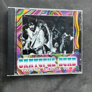 May include: A CD case with a psychedelic swirl design. The front features a black and white photo of a band performing on stage. The text "Grateful Dead From The Archives Vol. 3" is printed on the front.
