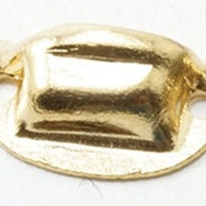 May include: Two gold-coloured metal drawer pulls with a rectangular shape and a raised design. The pulls have two holes for attaching to a drawer.