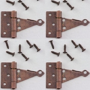 May include: Four sets of antique copper hinges with a decorative, angled design. Each set includes two hinges and a pack of screws.