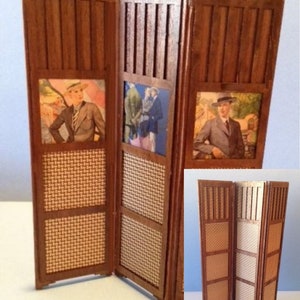 May include: A three-panel room divider made of wood with a woven cane insert. Each panel features a framed image of a person in vintage clothing. The divider is shown in both open and closed positions.