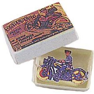 May include: A small rectangular box with a lid featuring a graphic of a motorcycle and the text DAREDEVIL. Inside the open box sits a cutout of a person riding a motorcycle, rendered in shades of purple, yellow, and black with a vintage aesthetic.