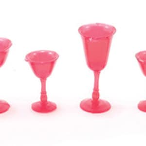 May include: Set of six pink glass goblets and wine glasses of varying sizes.