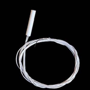 May include: A white cylindrical sensor probe attached to a long, thin white electrical wire coiled into a circular shape. The component features a smooth, solid white plastic casing at the tip, connected to a flexible, insulated white wire lead.