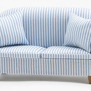 May include: Miniature blue and white striped sofa with two matching throw pillows. The sofa has a classic design with curved arms and wooden legs. A charming piece for a dollhouse or miniature scene.