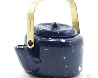 May include: A miniature dark blue teapot with a white speckled pattern, featuring a removable lid and a metallic gold-toned arched handle. The teapot has a small spout and a rounded body, with the text AAM All About Miniatures visible.