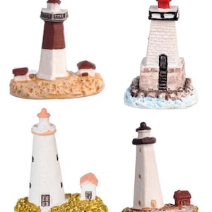 May include: Four miniature lighthouse figurines. One is white and brown, another is white with a red top, a third is white with a pink top, and the last is white with a black top. Each lighthouse has a unique base.