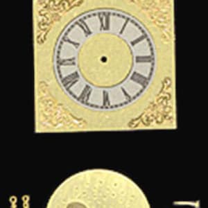 May include: A gold-colored square clock face with an arched top featuring numbers 5 through 30, a circular dial with Roman numerals, and decorative corner filigree. Included are a circular gold plate with two circular cutouts, two clock hands, and two screws.