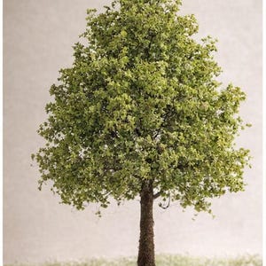 May include: A set of three ceramic mugs with a speckled, matte finish. The mugs are in shades of cream, light gray, and dark gray. Each mug has a simple, minimalist design, perfect for coffee or tea.