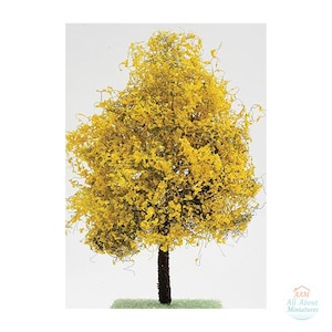 May include: A miniature model tree featuring a dark brown textured trunk and a dense, rounded canopy of bright yellow foliage. The tree stands on a small, rectangular green base. A logo with the text AAM All About Miniatures is visible.