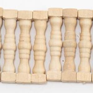 May include: A collection of unfinished wooden miniature balusters, perfect for craft projects. Each baluster features a square base and top, with a decorative, turned design in the center. The natural wood color allows for easy customization with paint or stain.