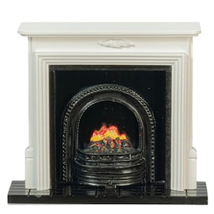 May include: A miniature white fireplace mantel with a black arched insert and a black hearth base. The interior features a black grate containing a moulded, painted representation of glowing orange, yellow, and red flames within the firebox.