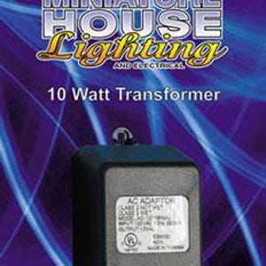 May include: A black 10-watt transformer with a label, for miniature house lighting. The transformer has a loop on top and is set against a purple and blue background. The text "Miniature House Lighting" is at the top.