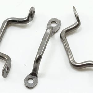 May include: Three metallic, gunmetal-colored handles with a curved, bridge-like shape. Each handle features two flat, circular mounting tabs at the ends, each containing a single pre-drilled hole for attachment to a surface or object.