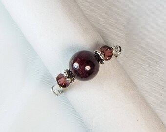 Cynthia Lynn "JANUARY'S CHILD" Ladies' Deep Red Garnet January Birthstone Silver Stretch Ring