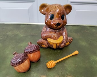 Vintage Honey Bear ceramic jar with honey plastic stick along with acorn shaped salt and pepper shakers for a 1970's brown kitchen look.