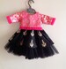 Tutu edged brocade blouse and tutu edged hand embroidered raw silk skirt 