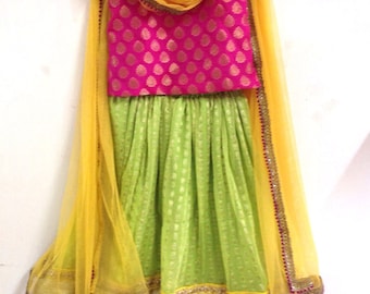 Girls brocade and chiffon lehenga in pink and lime green with yellow highlights