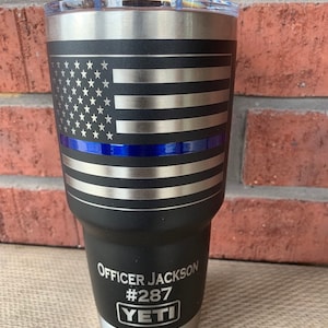 Firefighter and Police YETI cup with thin red or blue line laser engraved and powder coated line. This Iisting includes shipping prices Blue