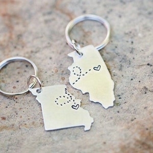 Two State Keychain set by Nelliebead offers your state marked with a heart on your custom cities and fun loopy trail connecting the hearts.