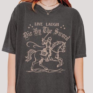 live laugh die by the sword. funny medieval meme graphic tee for the ren faire. trendy for men and women. oversize fit. comfort color t-shirt available in plus sizes.