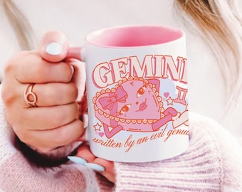 cute gemini written by evil genius zodiac mug, funny astrology meme, trendy pink coquette girly, retro heart cartoon book cup, terriblay