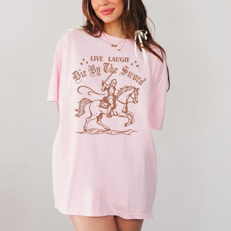 live laugh die by the sword. funny medieval meme graphic tee for the ren faire. trendy for men and women. oversize fit. comfort color t-shirt available in plus sizes.