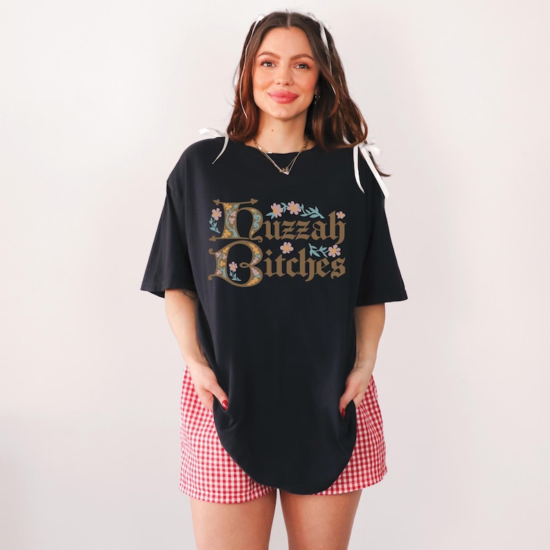 huzzah bitches funny medieval meme graphic tee on a comfort color t-shirt available in plus sizes and gender neutral