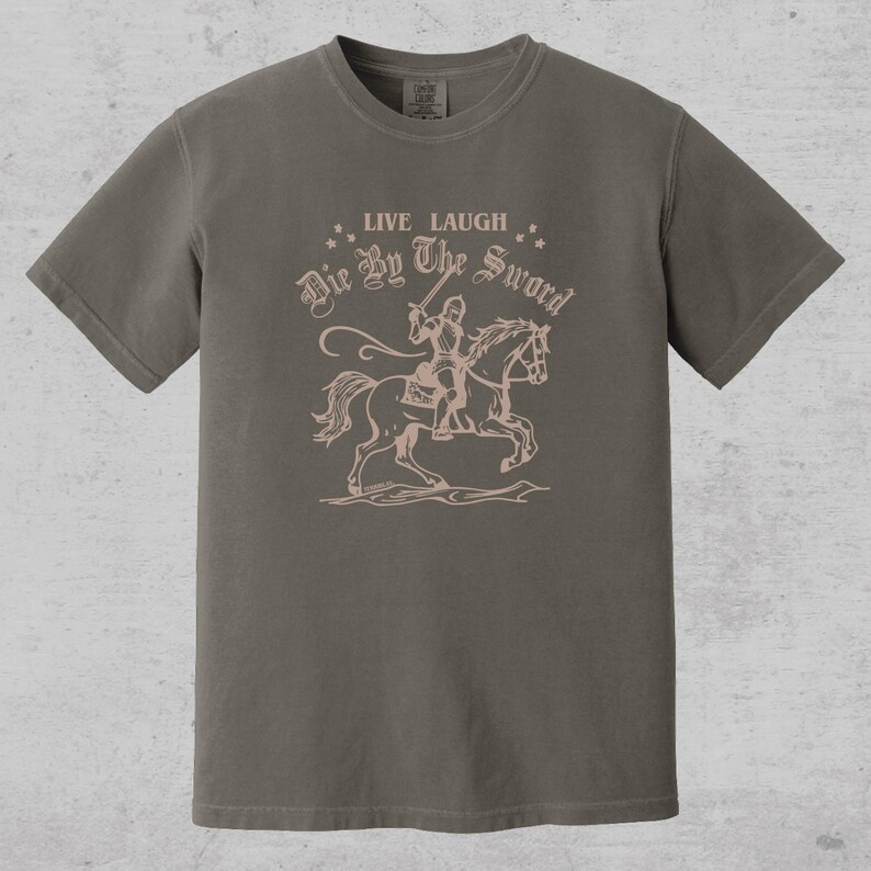 live laugh die by the sword. funny medieval meme graphic tee for the ren faire. trendy for men and women. oversize fit. comfort color t-shirt available in plus sizes.