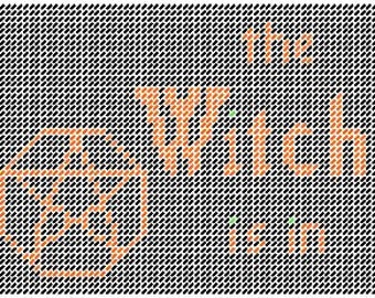 A bruxa está em uma placa com padrão de lona plástica