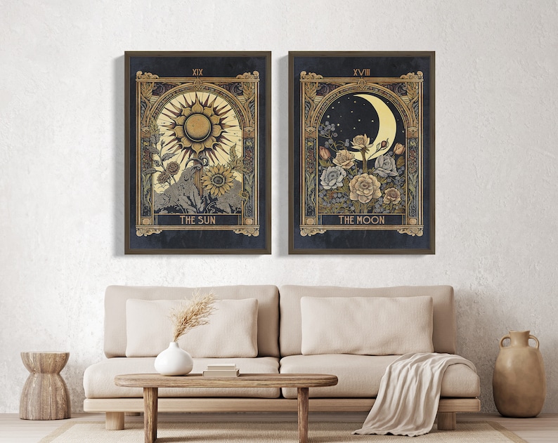 May include: Two framed prints with a dark blue background and gold accents. The left print features a sun with the text "XIX THE SUN" and the right print features a crescent moon with the text "XVIII THE MOON".