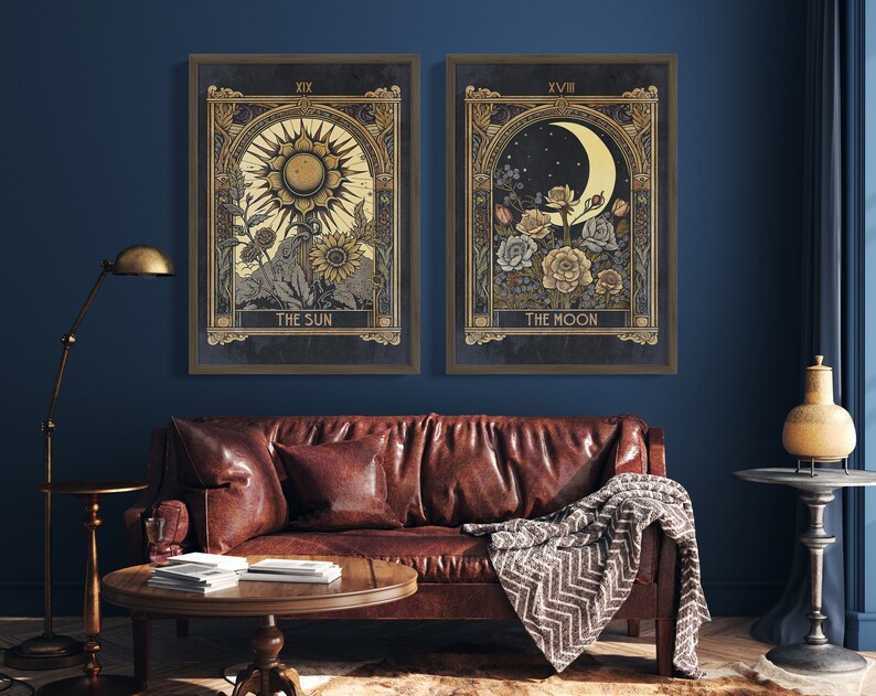 May include: Two framed prints with gold accents, depicting tarot cards. The left print shows the Sun card with a sun and flowers. The right print shows the Moon card with a crescent moon and flowers.