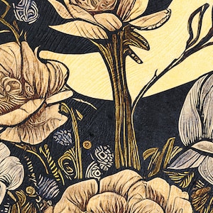 May include: A close-up of a woodblock print featuring stylized flowers in shades of brown, white, and blue. The flowers are arranged in a cluster, with their petals overlapping and creating a sense of depth. The background is a dark, textured surface.
